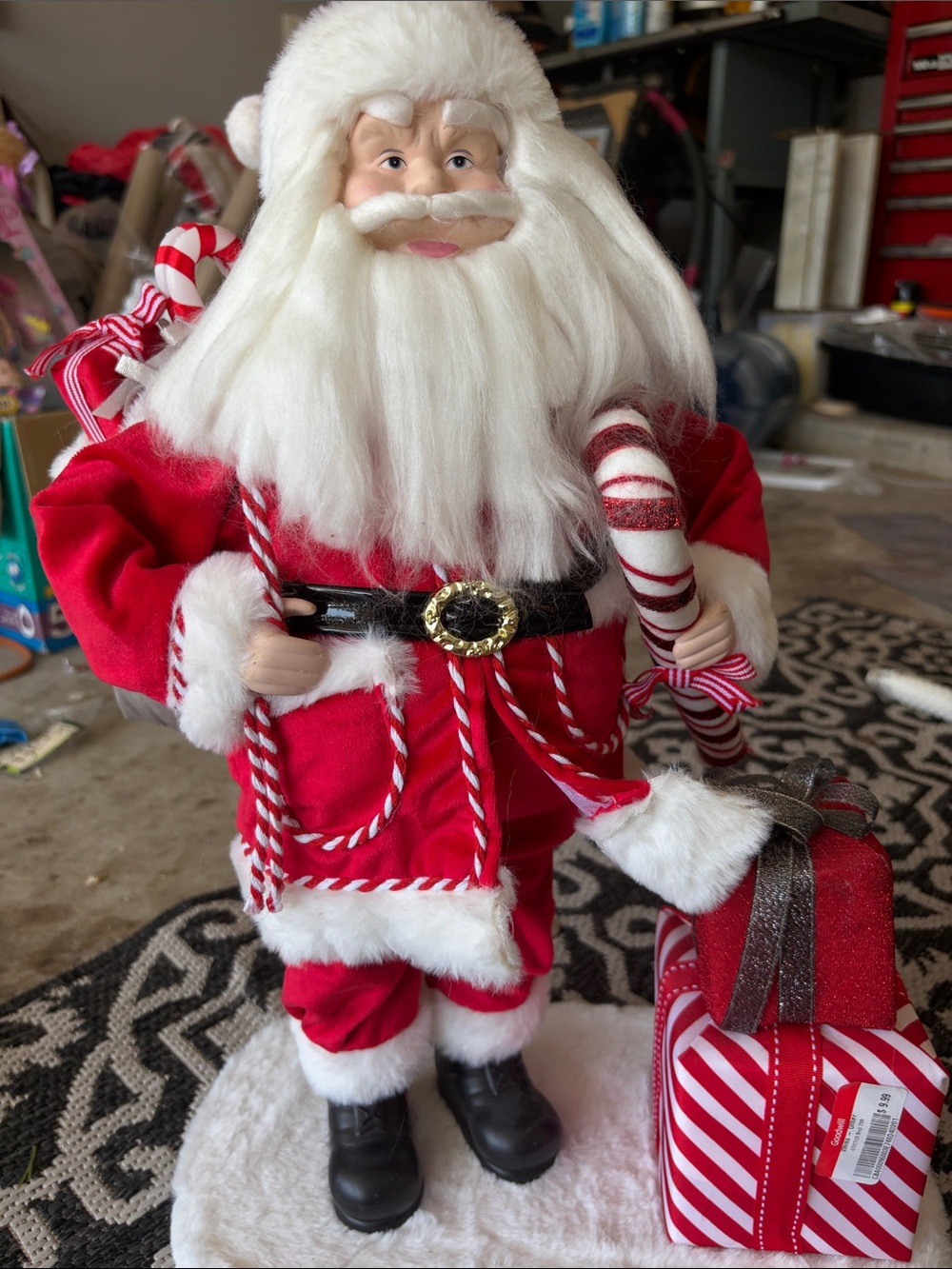 Red and White Santa Figurine with Candy Cane